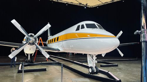 Dynamite Details team performing professional ceramic coating application in Delaware studio