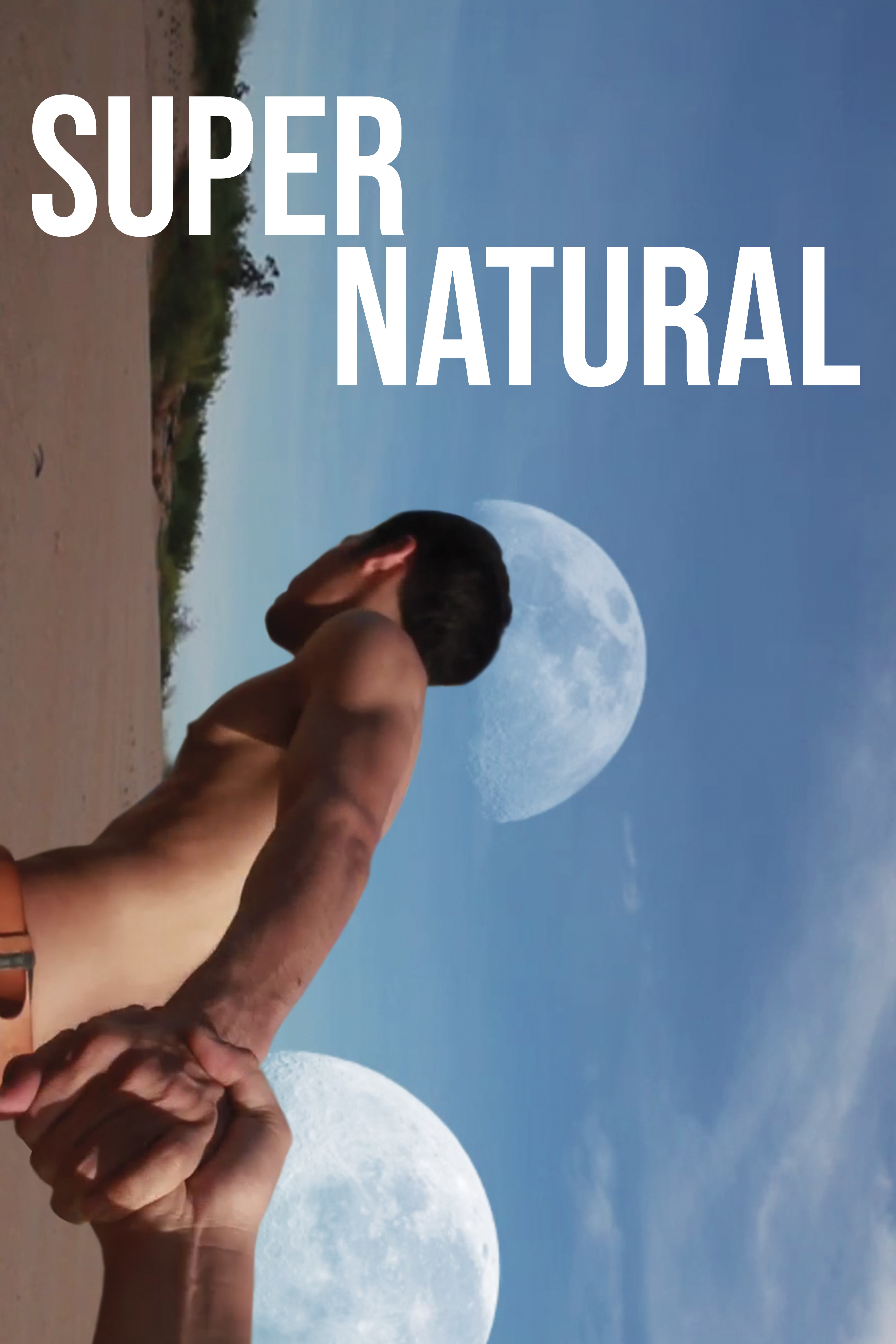 Supernatural movie poster featuring a shirtless man standing on a beach beneath two glowing moons in a blue sky.