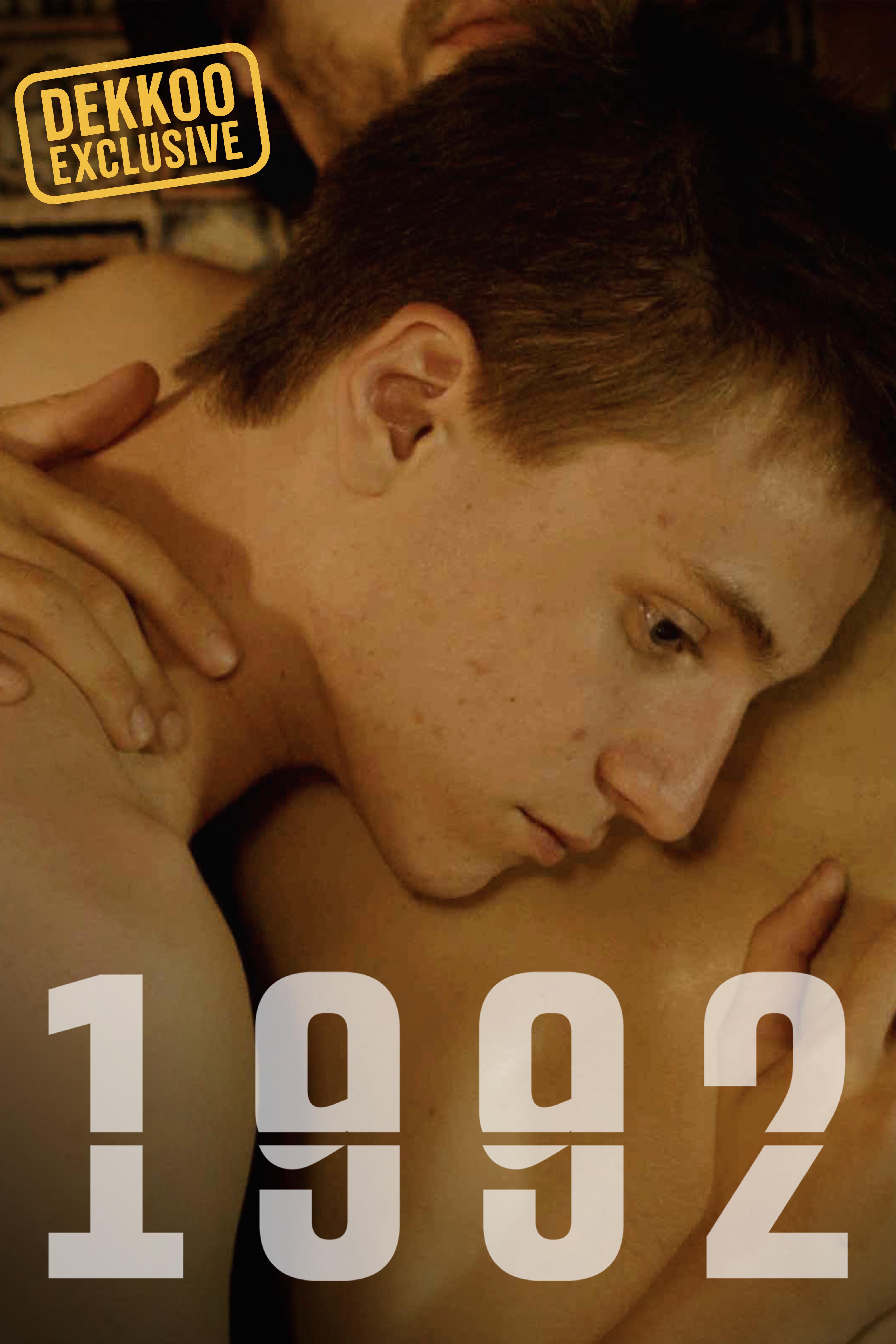 1992 Dekkoo Exclusive cover art featuring two men in an intimate embrace.