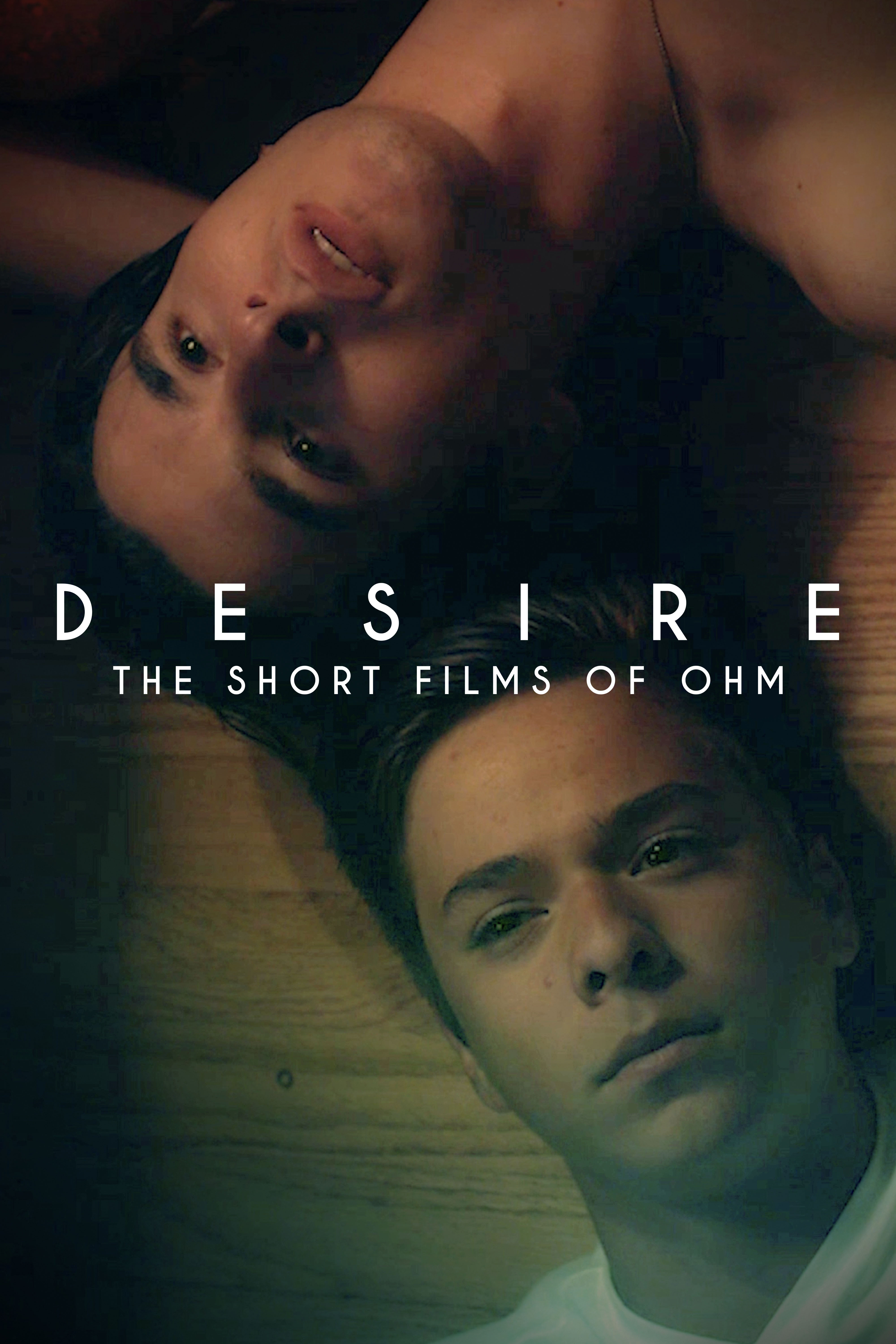 Desire: The Short Films of Ohm cover art featuring two men lying together, their faces shown in a dark, intimate composition.