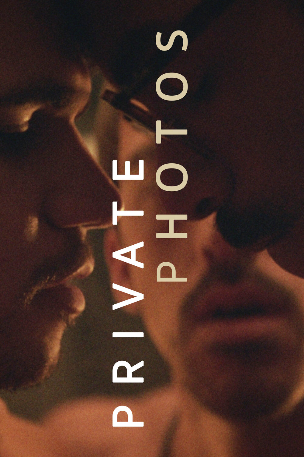 Poster artwork for Private Photos, featuring an intimate, softly lit close-up of two men embracing.