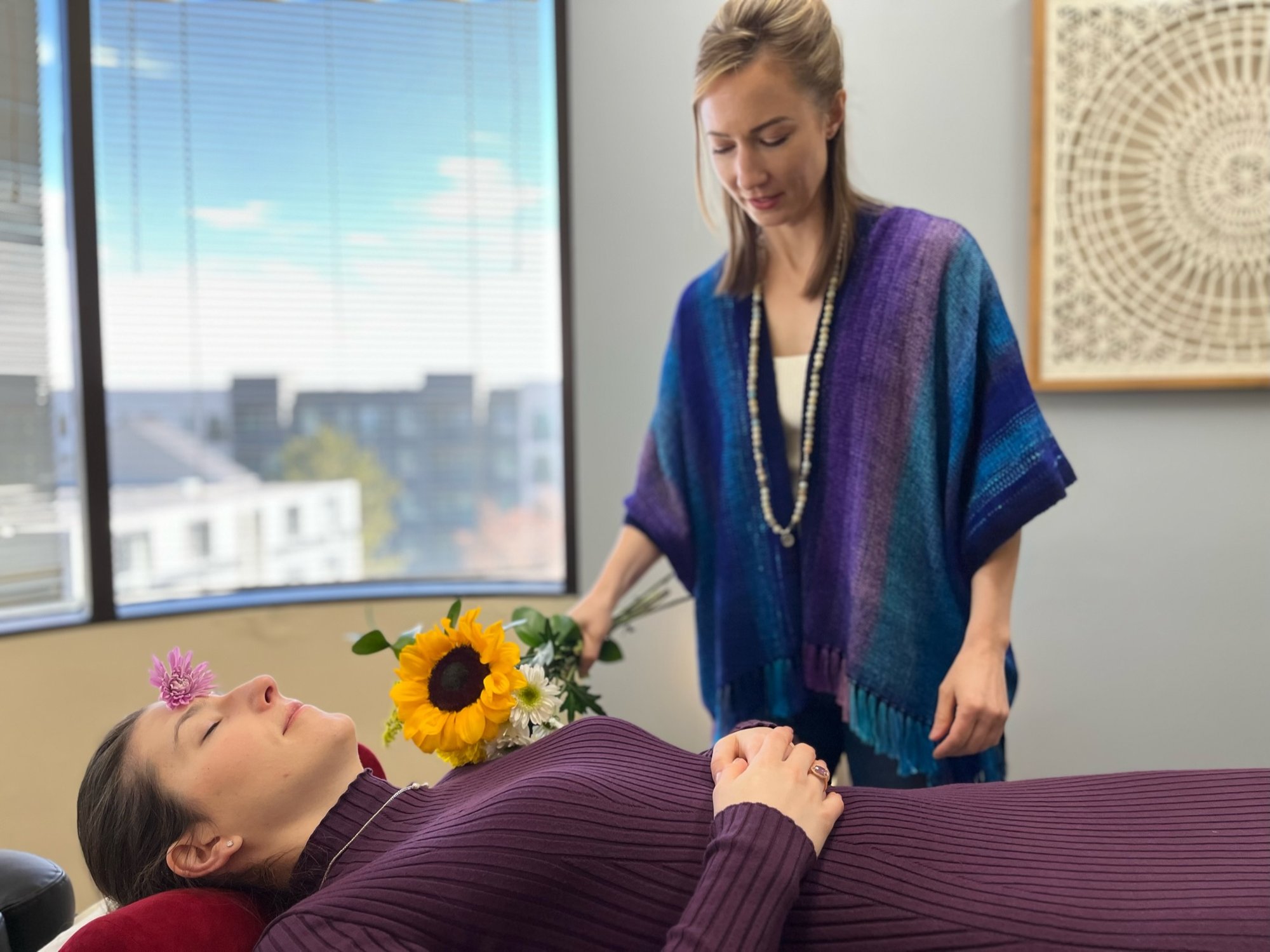 Lauren Mangelinckx performing energy healing at Brahmaloka Healing Arts