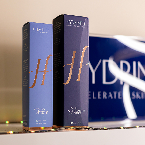 Two Hydrinity skincare boxes: Hyacyn Active Purifying Mist and Prelude Facial Treatment Cleanser.