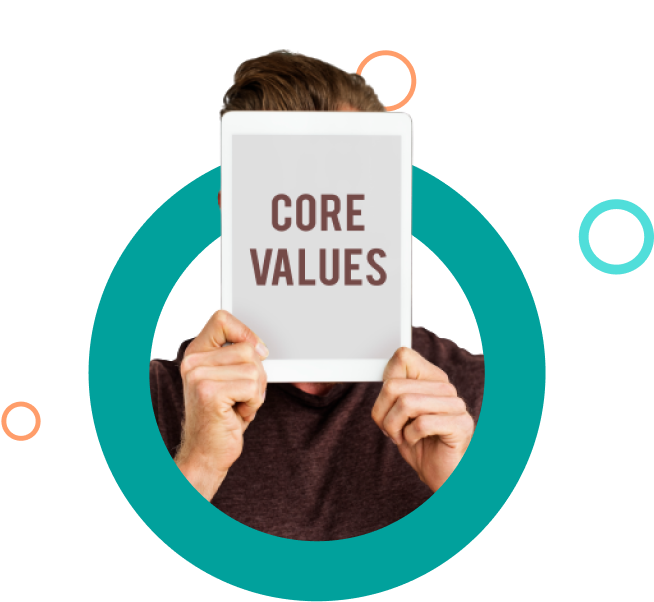 Person holding a tablet in front of their face displaying the words 'CORE VALUES'.