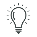 Icon of a light bulb with rays indicating illumination.