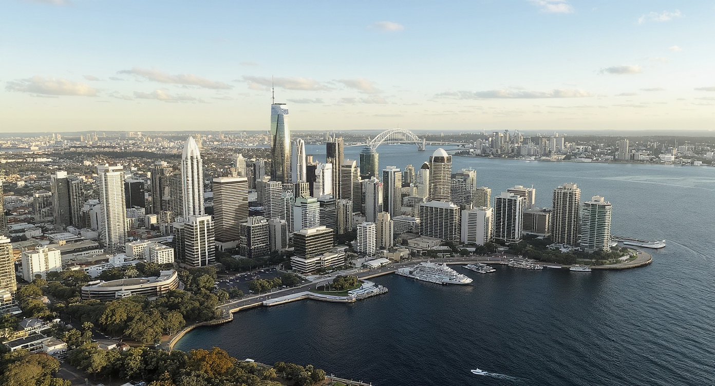 Aerial view of Sydney CBD skyline with residential apartment towers and Harbour Bridge, - Somerstone Property Group