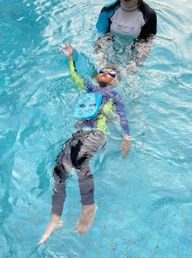 Our certified coaches use gentle, supportive techniques to help children build water confidence, starting with essential skills like independent back-floating with safety aids.