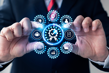 Person in suit holding transparent interface with quality control and business icons.