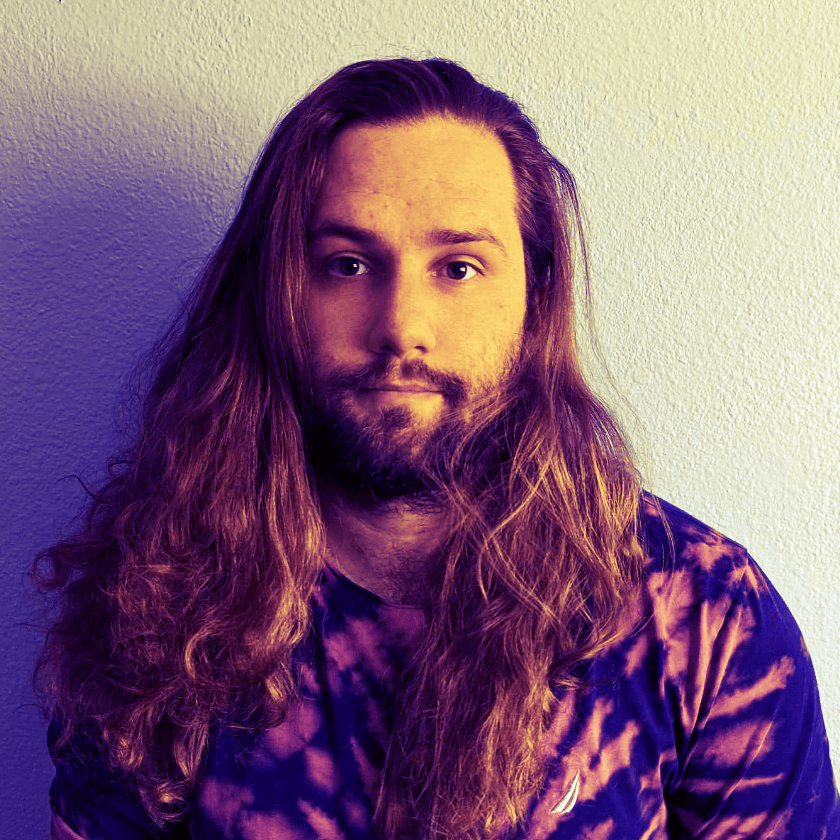 A rotating gif of four images of Wyatt Hill, and colored with purple and yellow lighting, some show with short hair, some show with long