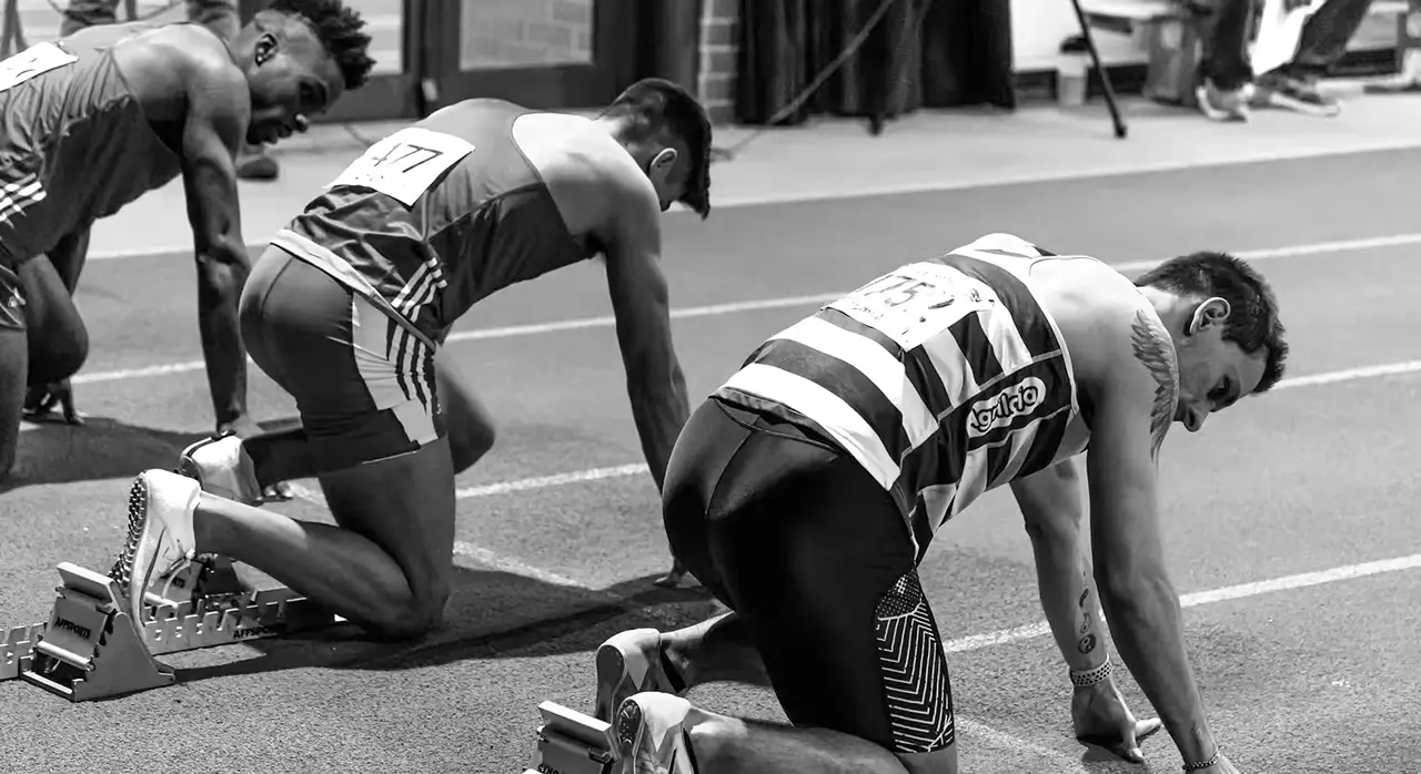 A race track with multiple runners in different uniforms, symbolizing the competitive streaming industry.