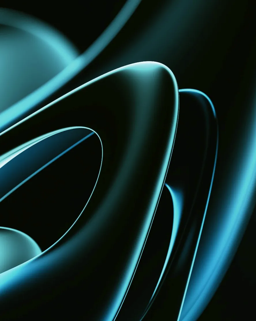 Close-up of intertwined smooth, curved shapes illuminated with blue light on a dark background.