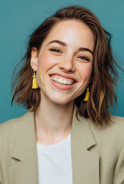 A formally dressed woman smiling confidently, conveying professionalism and trust in recruitment services.