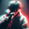 Blurred and color-distorted image of a person holding a microphone, singing or speaking.