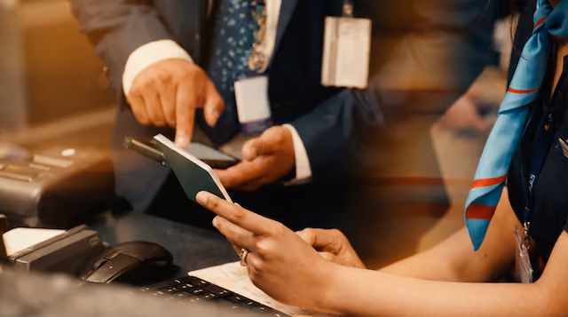 Two airline customer managers identifying and matching passport data within Ink's mobile check-in system.