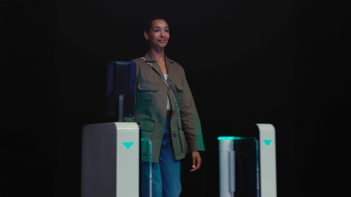 A girl working seamlessly throughout the Ink security airport gate with biometrics