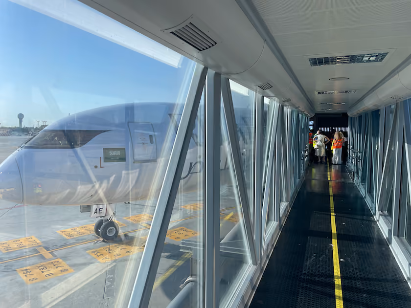 Riyadh Air aircraft at the jet bridge with ground staff, marking the airline's Spanish debut in Málaga and Madrid