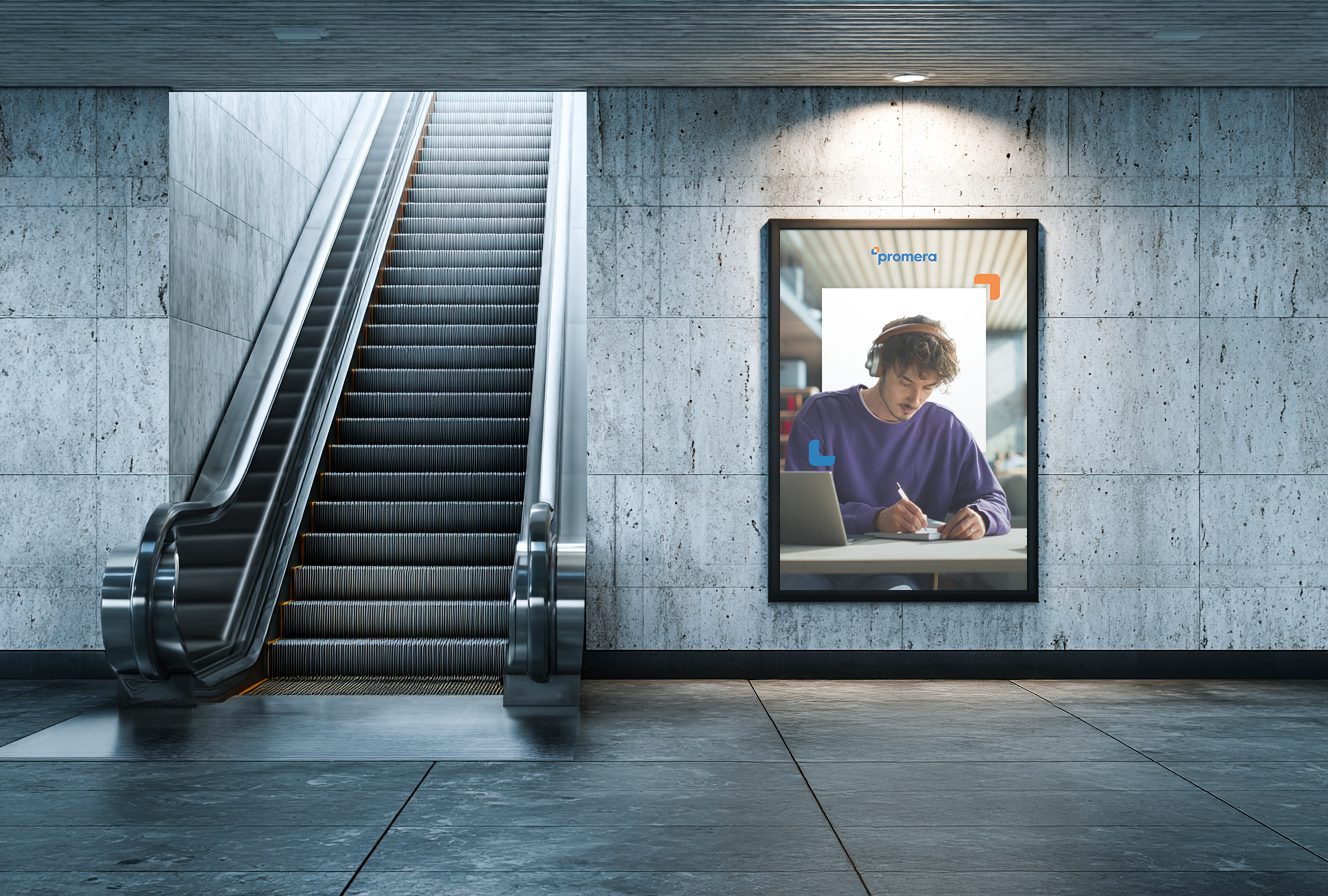 Promera out-of-home ad displayed beside an escalator