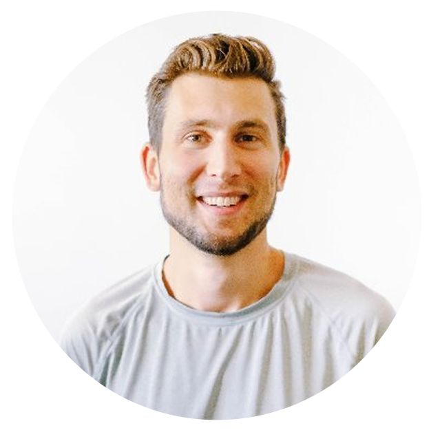 Portrait of a smiling man with short blonde hair and a light-colored shirt.