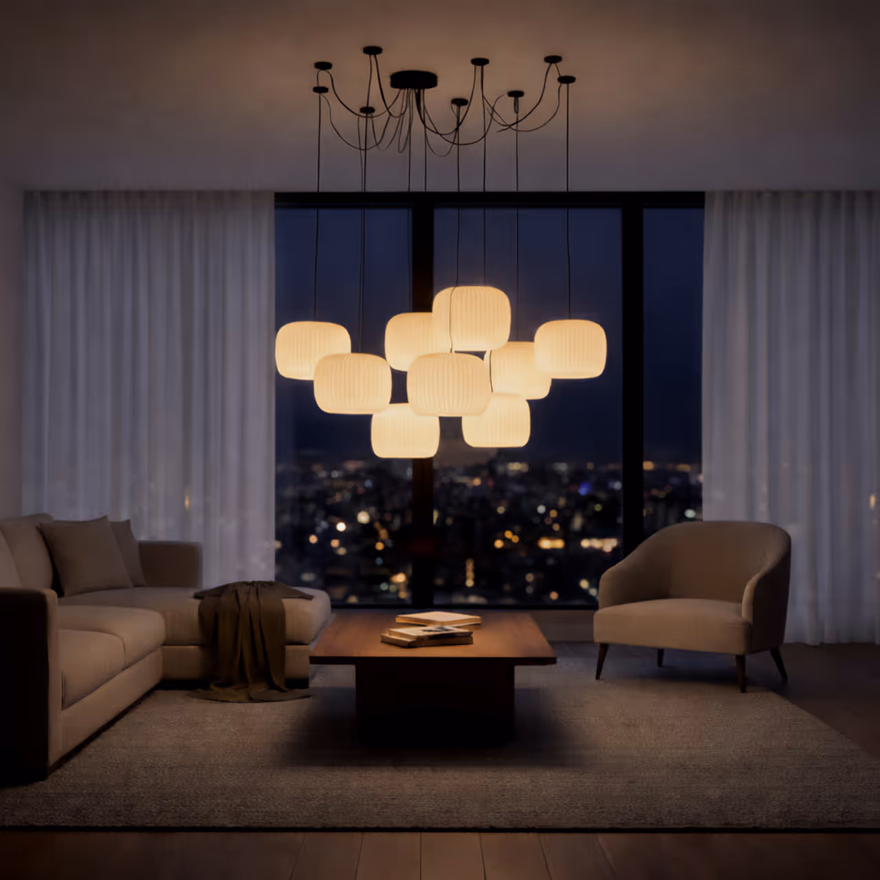 Modern living room at night with soft glowing pendant lights, a sectional sofa, armchair, and city view through large windows.