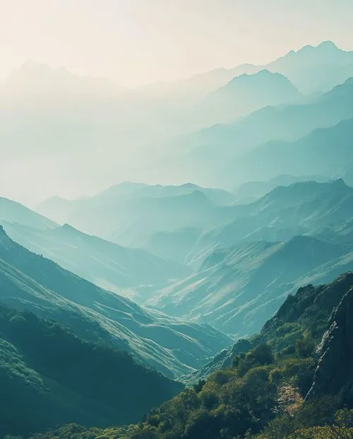 A serene mountain landscape with misty hills, symbolizing the clarity and flexibility of Nimbus Library designs.