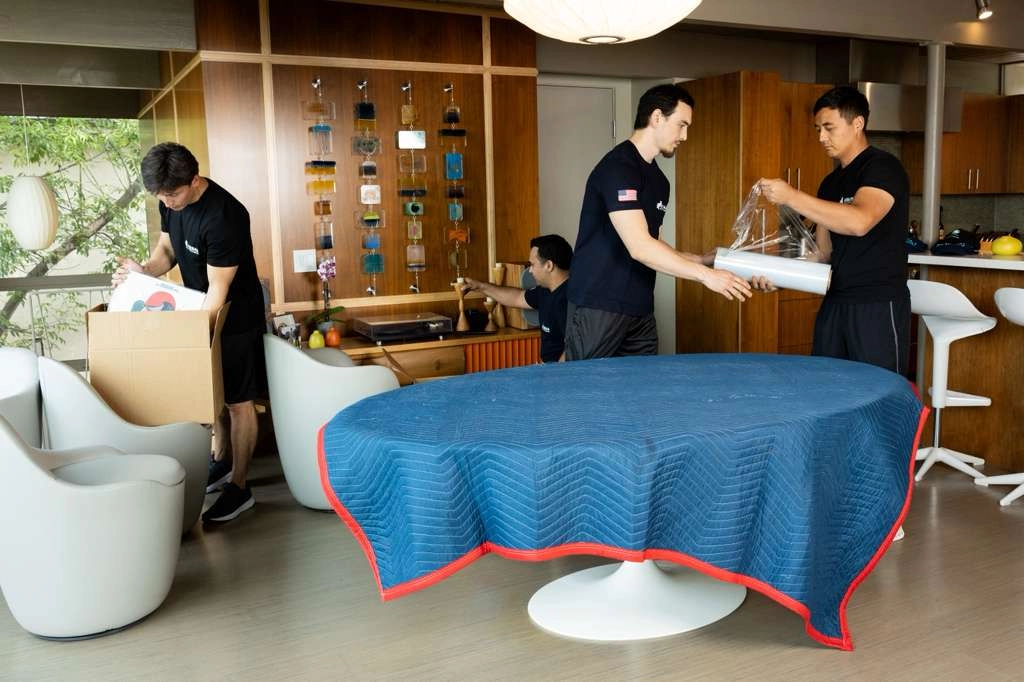 Professional Urban Moving Company team packing furniture and boxes for a residential move in Los Angeles