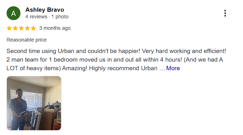 Customer review by Ashley Bravo with a 5-star rating praising a two-person moving team for efficient service in moving heavy items from a one-bedroom apartment within four hours, accompanied by a photo of a man standing next to packed boxes indoors.