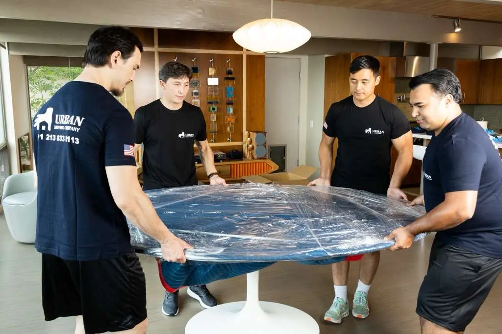 Urban Moving Company team loading furniture for move
