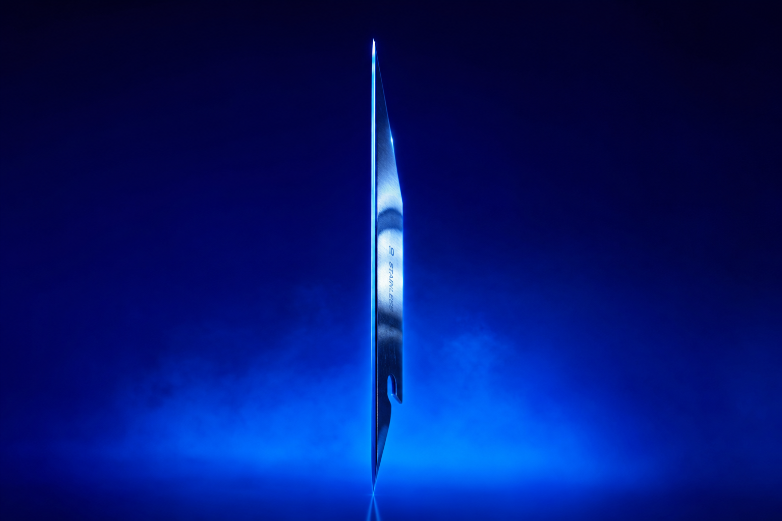 Single razor-thin steel blade balanced upright on its edge in dark atmospheric void
