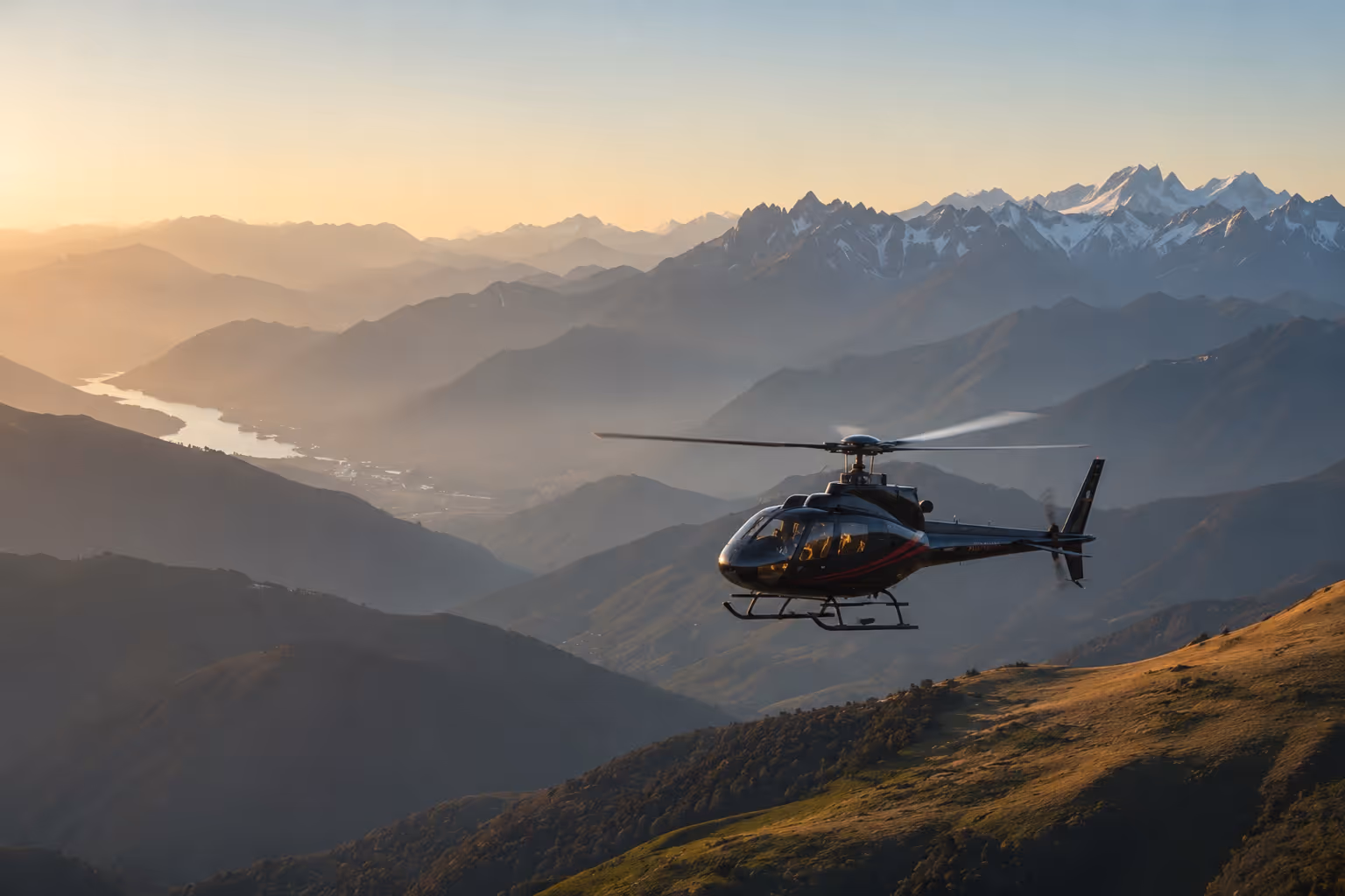 Helicopter flying over the hills at sunset — Moveolux multi-modal luxury travel coordination for travel advisors across land, air and water.