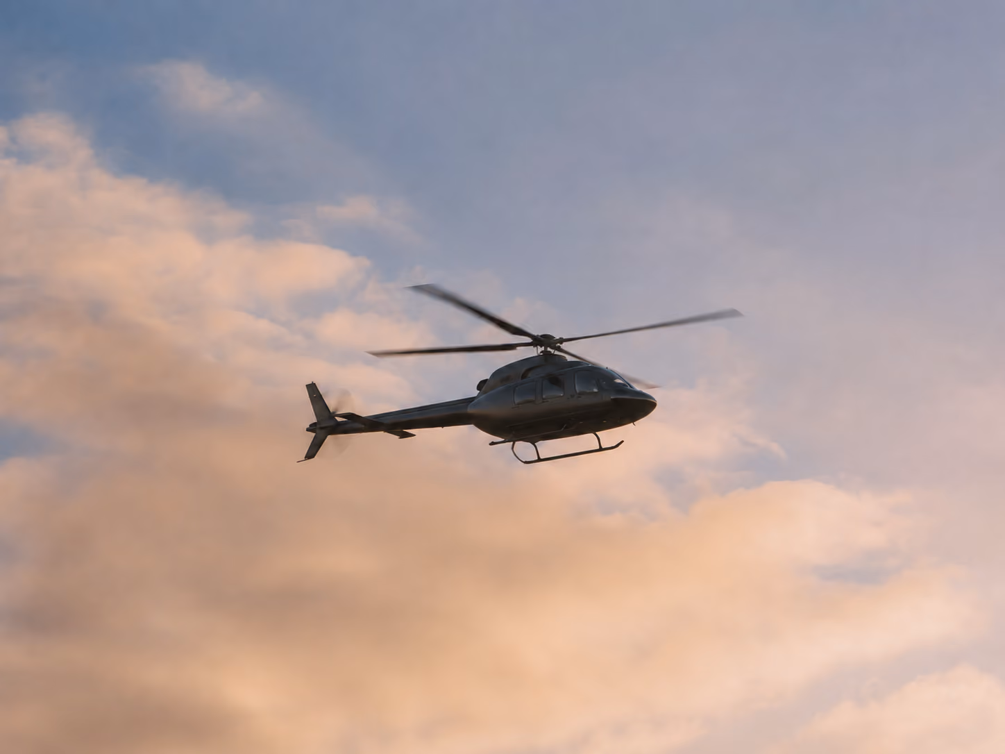 Moveolux private jet in flight — luxury air travel and helicopter charter services.