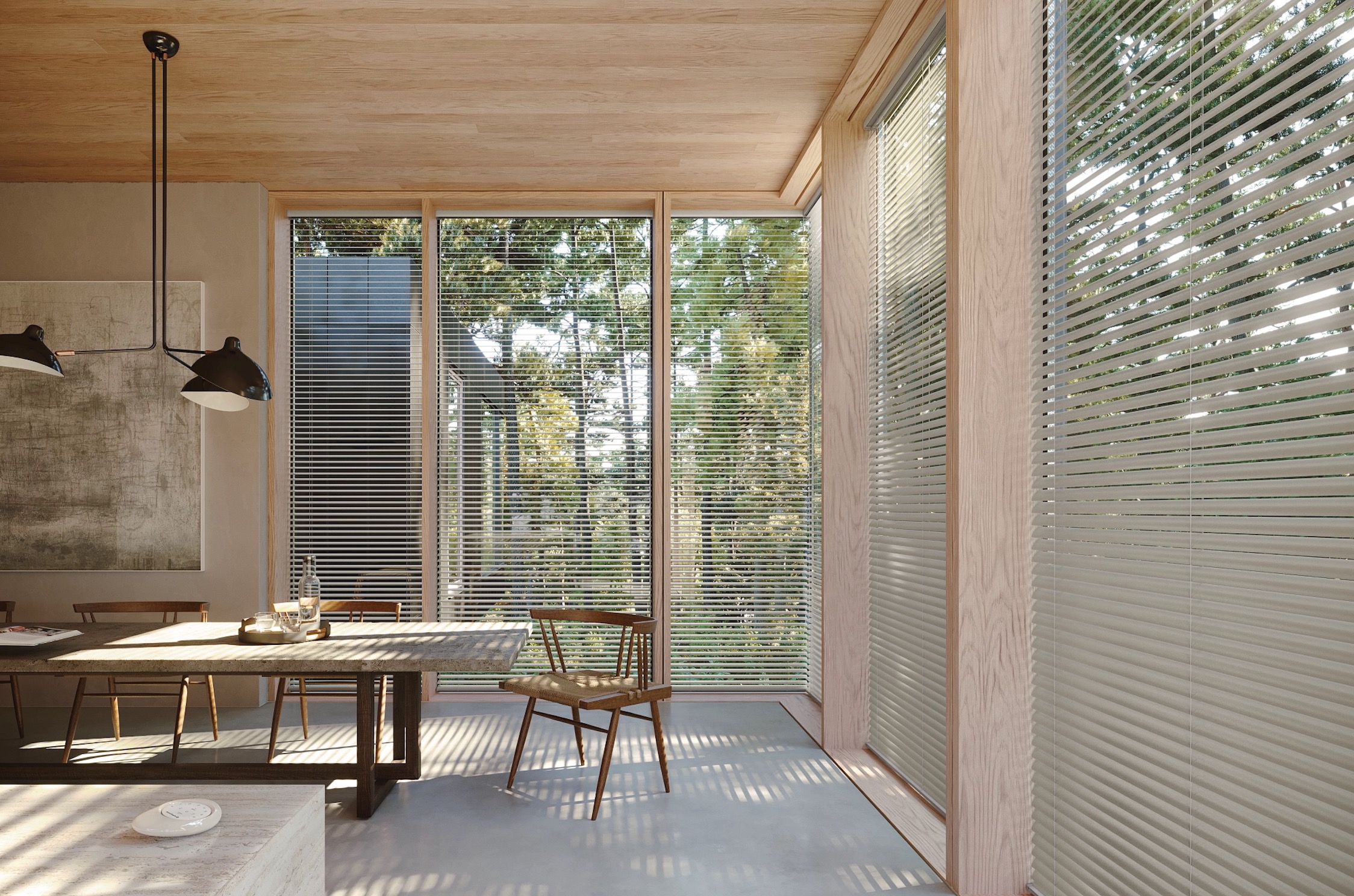Pale aluminum horizontal blinds on floor-to-ceiling dining room windows overlooking trees