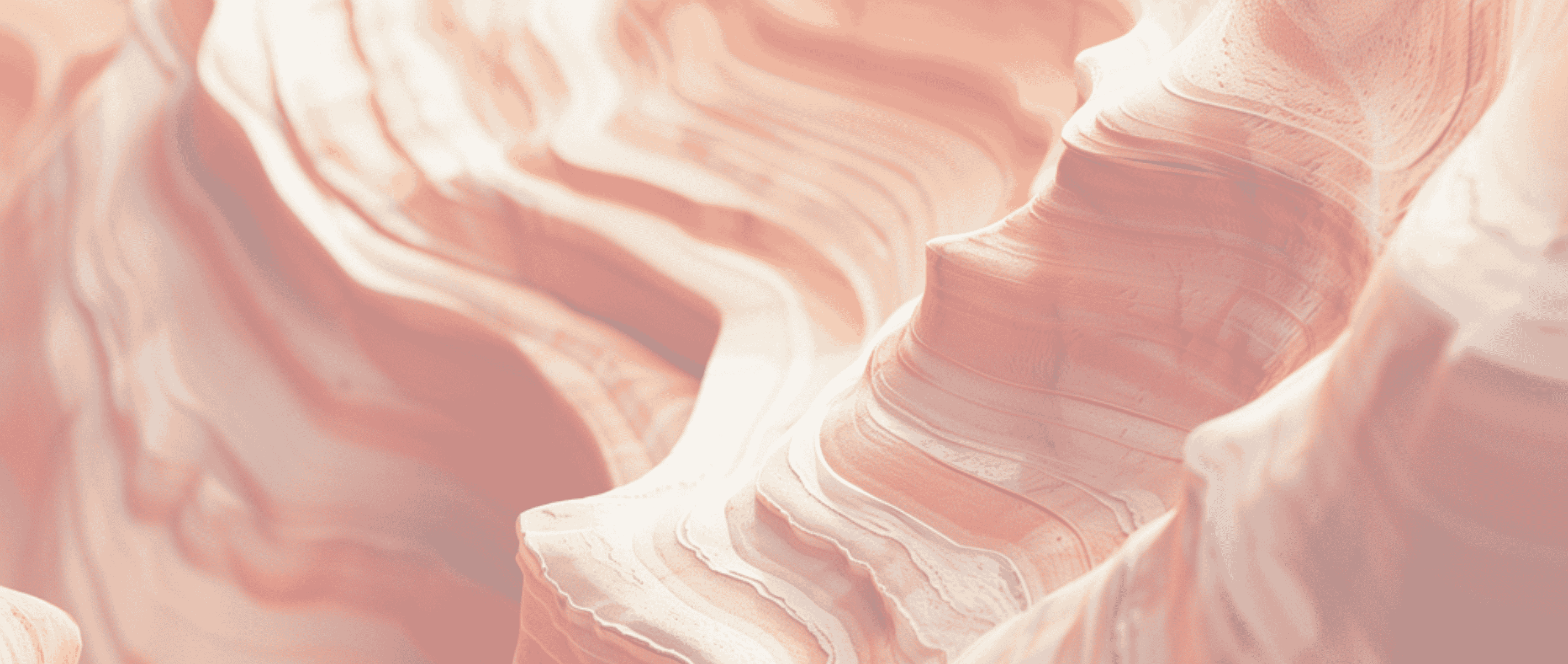 Close-up of layered red and orange sandstone formations with smooth, wave-like patterns.