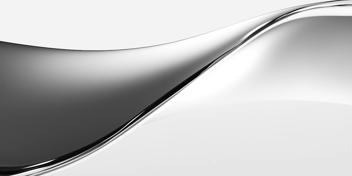 Abstract smooth metallic wave with reflective silver gradient on white background.