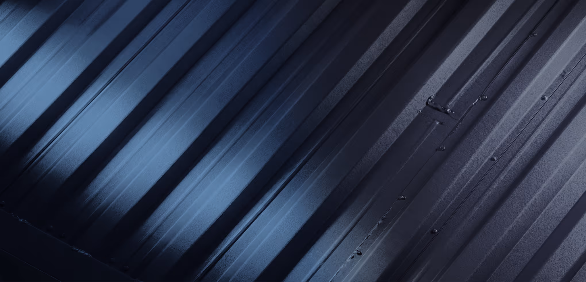 Close-up of corrugated metal sheets with a gradient blue lighting effect.