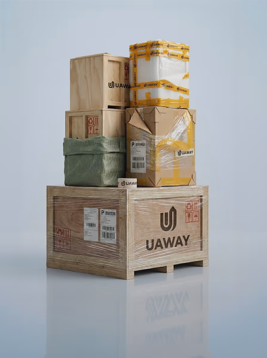 Stack of various Uaway-branded packages including wooden crates, cardboard boxes, and a green fabric-wrapped box on a reflective surface.
