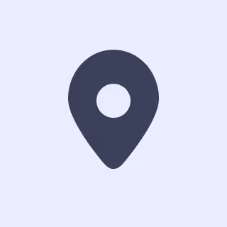 Simple dark location pin icon on a light background.