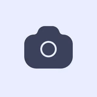 Dark gray camera icon on a light purple background.