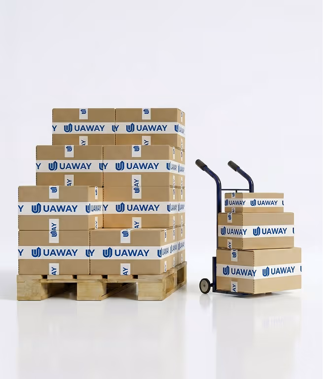 Stack of cardboard boxes labeled 'UAWAY' on a wooden pallet and a hand truck with more UAWAY boxes against a plain white background.