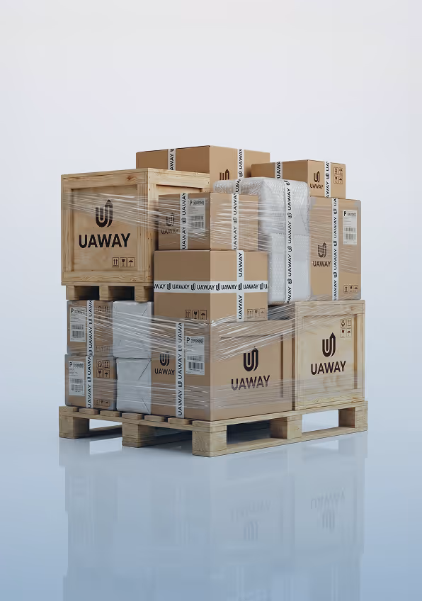 Wooden pallet stacked with various cardboard boxes and crates labeled UAWAY, secured with clear plastic wrap.