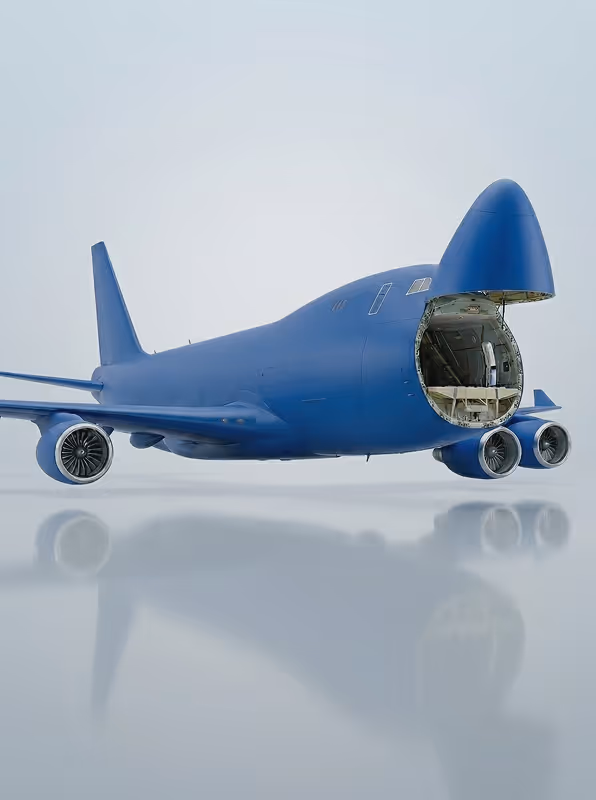 Blue cargo airplane with its nose open, revealing the empty loading compartment.