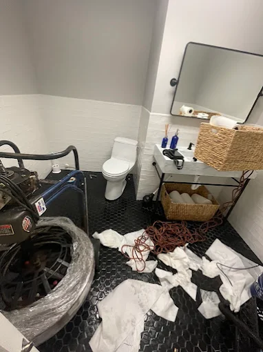 Bathroom plumbing services in Charleston, SC - bathroom under renovation with toilet and washing machine