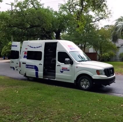 Roto-Rooter service van parked on a residential street in Charleston, SC