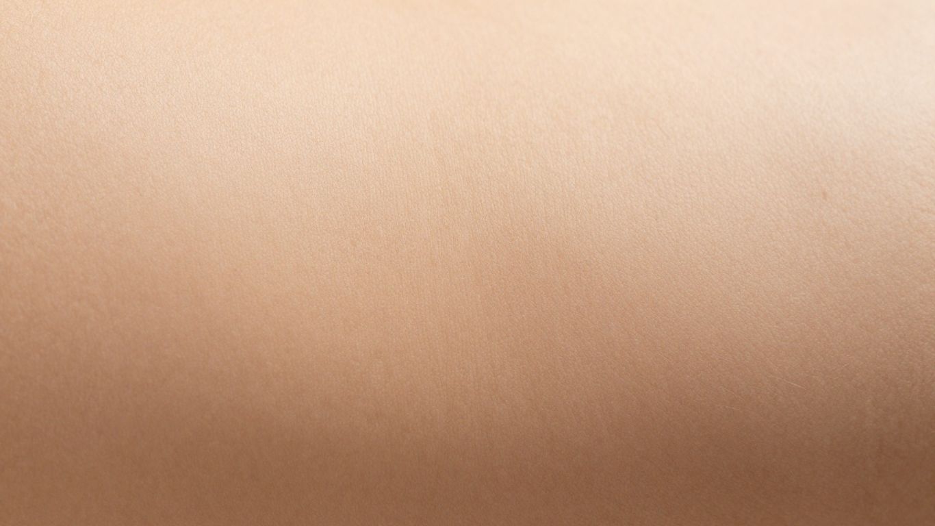 Close-up of pubic area with visible hair follicles.
