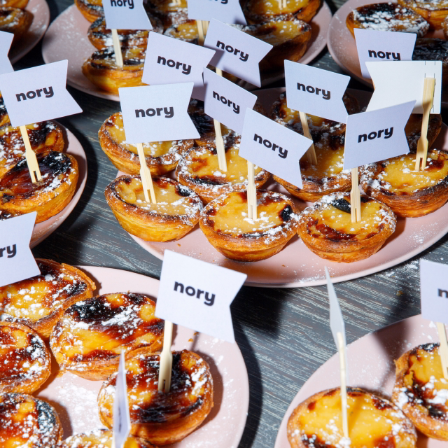 Nory-branded pastéis de nata treats at a company event