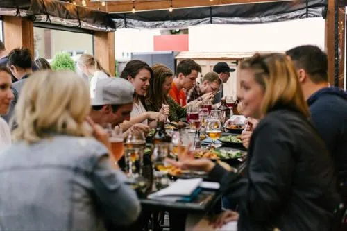 People sat enjoying food in a restaurant