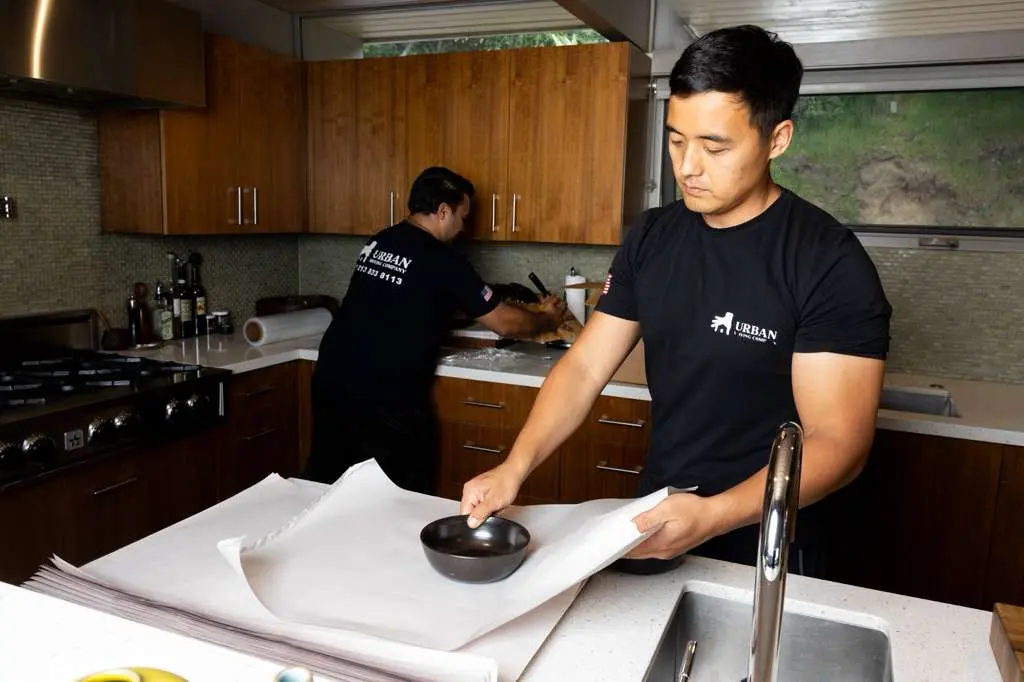 Urban Movers carefully packing fragile items