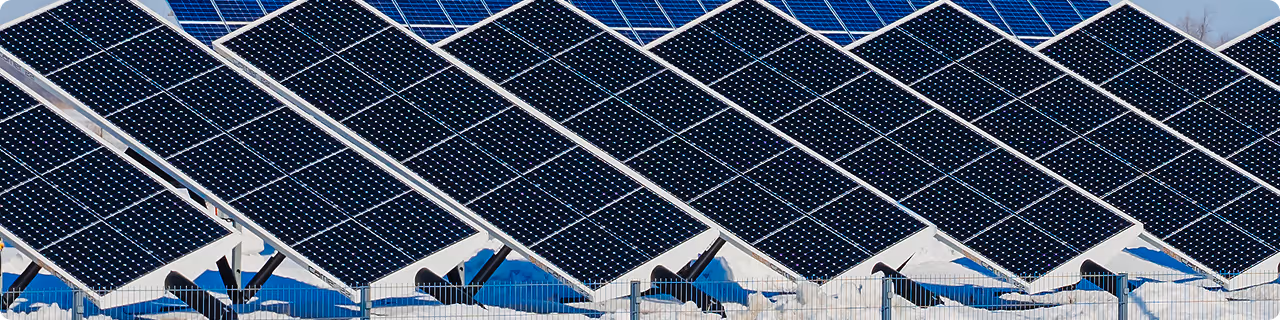 Solar panels on top of a building receiving power from the sun