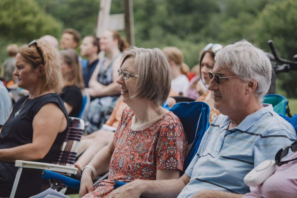 Woman and man listening to a talk