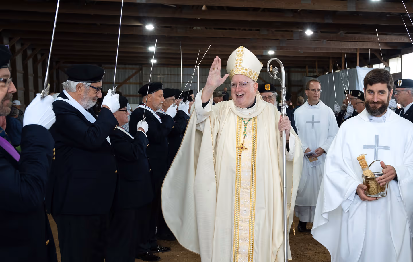 Bishop processing out of a barn Mass