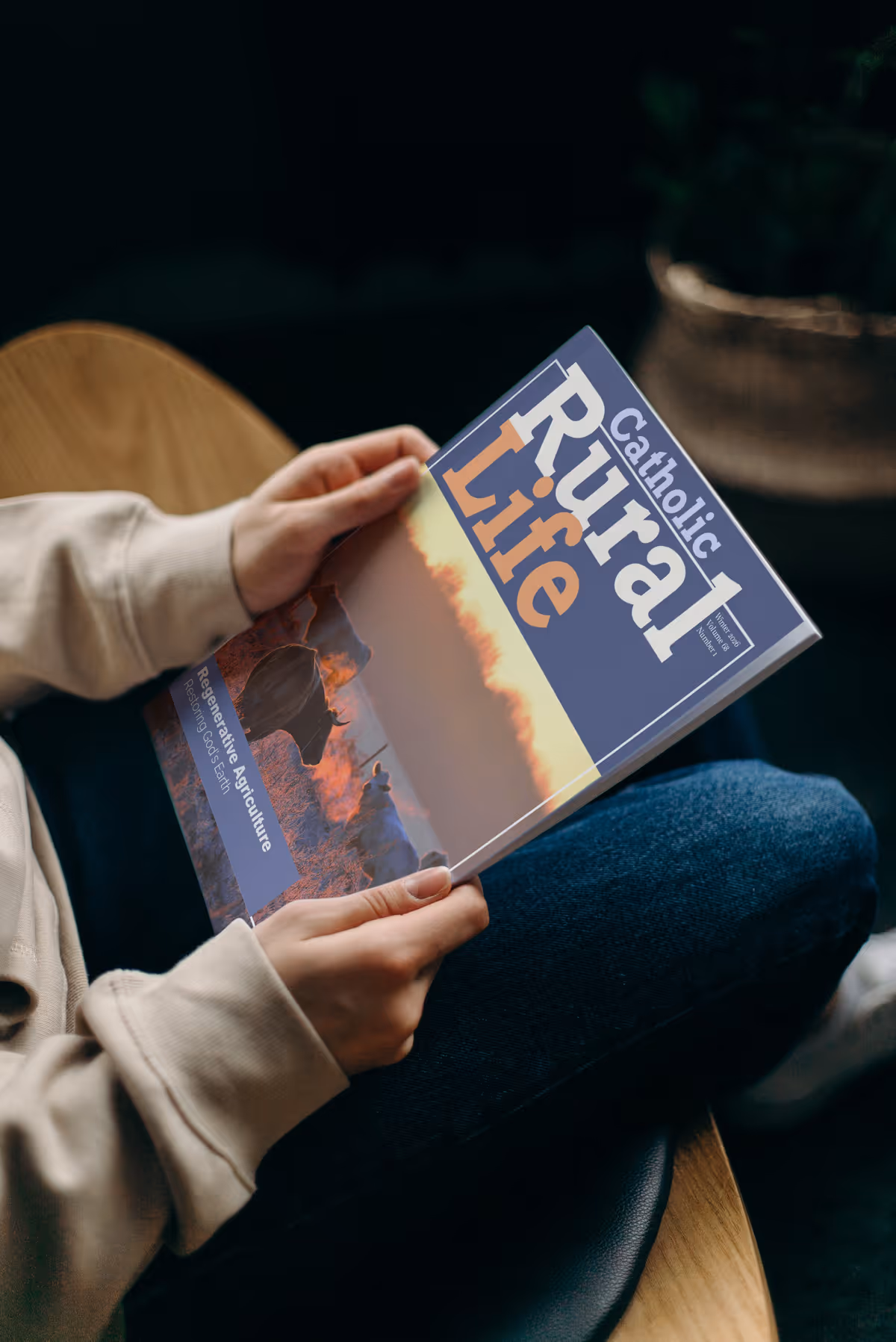 Person reading Catholic Rural Life magazine